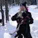 Elena Morgan unhitches her sled dogs following a training run near her home Wednesday, Jan. 19, 2022 in Britt, Minn. The 17 year old musher will be co