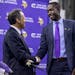 Vikings president Mark Wilf, left, and new General Manager Kwesi Adofo-Mensah shook hands after a news conference Thursday in Eagan, Minn.