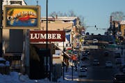 The old extractive economy and the new tourism economy at odds for over 50 years meet on E. Sheridan Street in Ely, Minn.