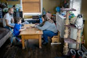 Felix Pliego and his wife Kali play with their son Mateo, 5, in their home in Minneapolis, Minn. Kali Pliego and her husband Felix, who is from Mexico
