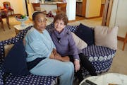 Caregiver Vickey Korlewala, left, with Gretta Freeman.
