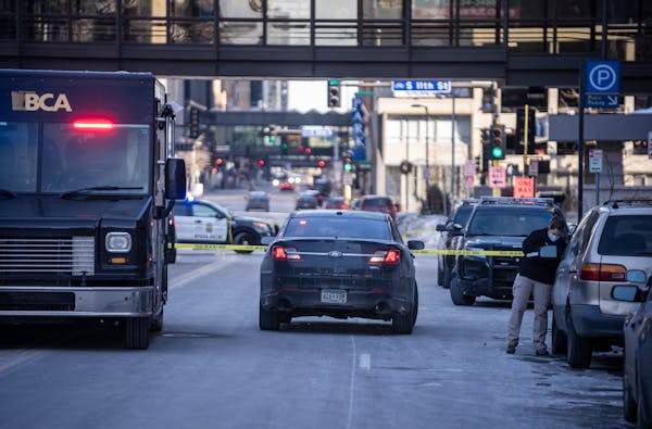 Minneapolis police shot and killed a man Wednesday morning near a downtown apartment building across from Orchestra Hall while serving an arrest warra