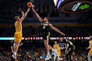 Minnesota Gophers guard Luke Loewe shoots a 3-point basket as he was defended by Purdue Boilermakers forward Mason Gillis in the first half.