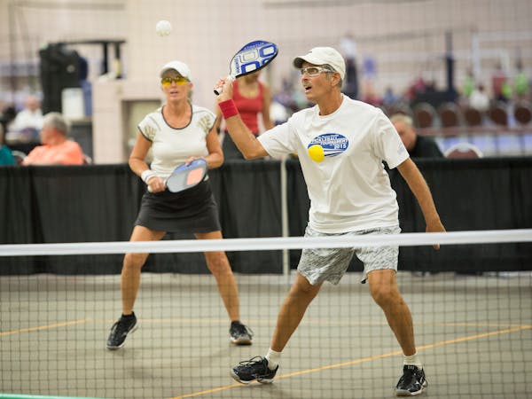 Marc and Diane Bock competed in an elimination round of pickleball in the age 60-64 age group Sunday at the National Senior Games. ] Aaron Lavinsky ¥