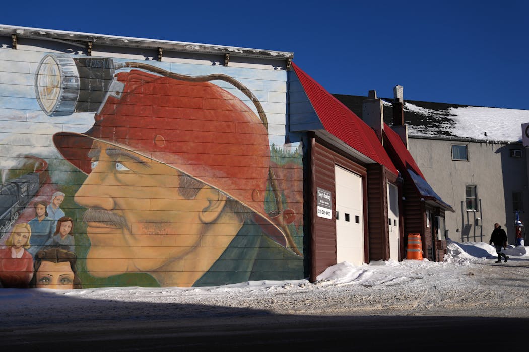 A mural of an iron ore miner sits painted on the side of a building on North Central Avenue Thursday, Jan. 27, 2022 in downtown Ely.
