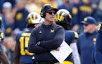 Michigan coach Jim Harbaugh said returning to the NFL was “something I wanted to explore.”