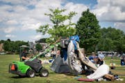 A interagency of Minneapolis parks, police and sanitation demolished tents and trashed them at a homeless encampment at Powderhorn Park in Minneapolis