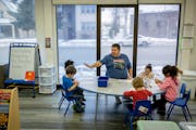 Michael Bustamente, cq, led children with a numbers game during his pre-school class at the Rainbow Child Development Center, in St. Paul, Minn., on T