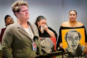 As Courtney Ross, the girlfriend of George Floyd, front, became emotional while speaking, Tiffany Brown, the sister of Jamar Clark, left to right, Kat