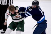 Marcus Foligno of the Wild fought Winnipeg’s Adam Lowry on Tuesday before the altercation ended with Foligno kneeing Lowry.