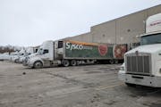 Trucks are parked outside Sysco Western Minnesota in St. Cloud on Thursday, Feb. 10, 2022, during a driver strike.