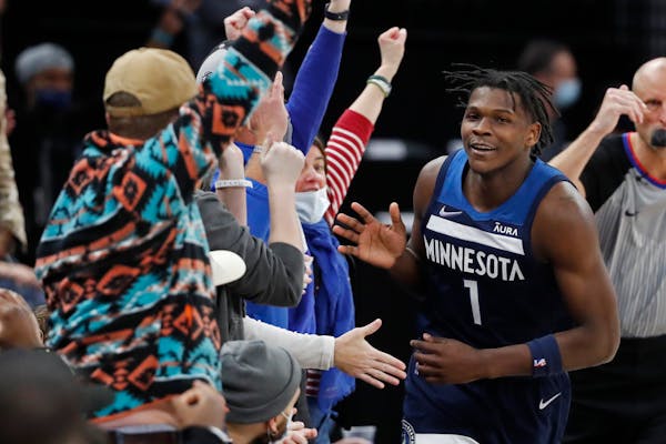 Anthony Edwards having fun with Timberwolves fans has become a common sight this season.