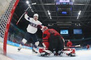 Brian O’Neill, left — the lone player back from the 2018 U.S. men’s Olympic hockey team — celebrated a goal by teammate Kenny Agostino in a 4