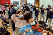 Samara Williams, a member of the string orchestra at Riverview West Side School of Excellence in St. Paul, practiced with classmates Feb. 10 for their