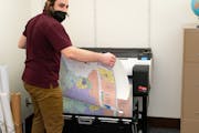Just hours after new maps were released Tuesday, Julius Menchikov was busy printing and mounting huge copies of the map showing new congressional dist