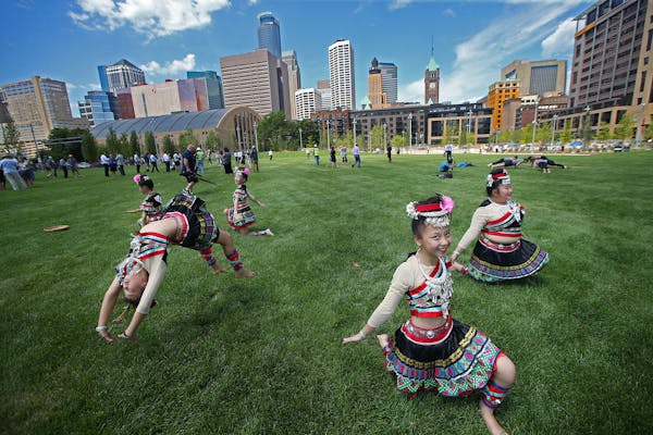 Members of the Iny Asian Dance Theater performed on the grounds of the Commons in Minneapolis as part of the grand opening ceremonies in 2016.
