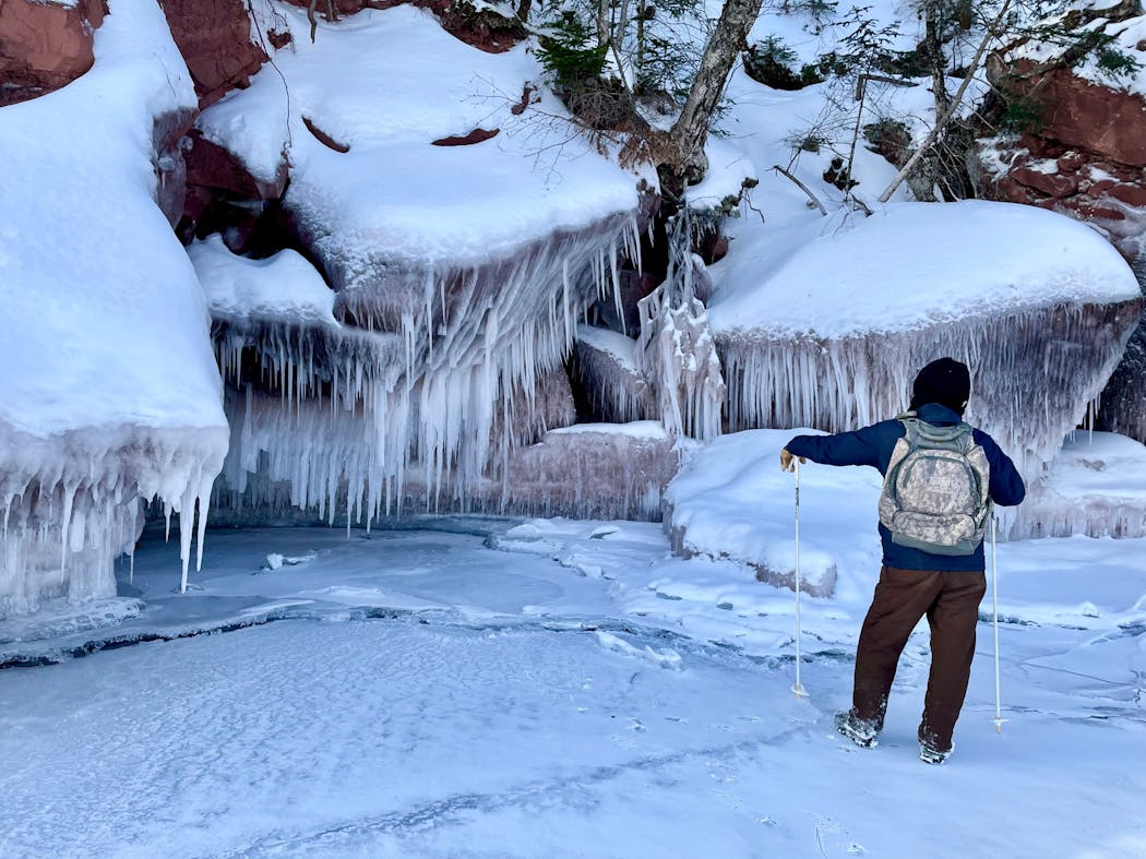 Tribe member Travis Barningham offers guided tours of the ice caves of Red Cliff Bay.