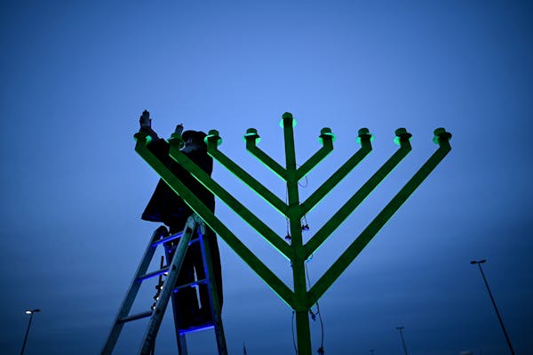 Rabbi Gershon Grossbaum readied the menorah before the start of the 2020 Drive-in Chanukah Spectacular at the St. Louis Park Lunds & Byerlys.
