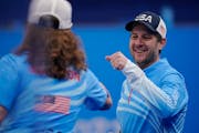United States’ John Shuster celebrates with Matt Hamilton during a men’s curling match against Denmark at the Beijing Winter Olympics on Thursday