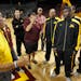 A look at the Gophers mens basketball program - Tubby Smith and players on media day for opening of season. Coach Tubby Smith, left talked to his play