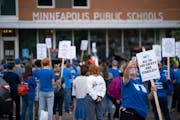 Teachers and staff picketed outside Minneapolis School District headquarters in 2021. Negotiations in the Minneapolis and St. Paul districts have drag