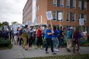 Minneapolis Public Schools teachers and staff and members of the Minneapolis Federation of Teachers rallied outside the district offices before a scho