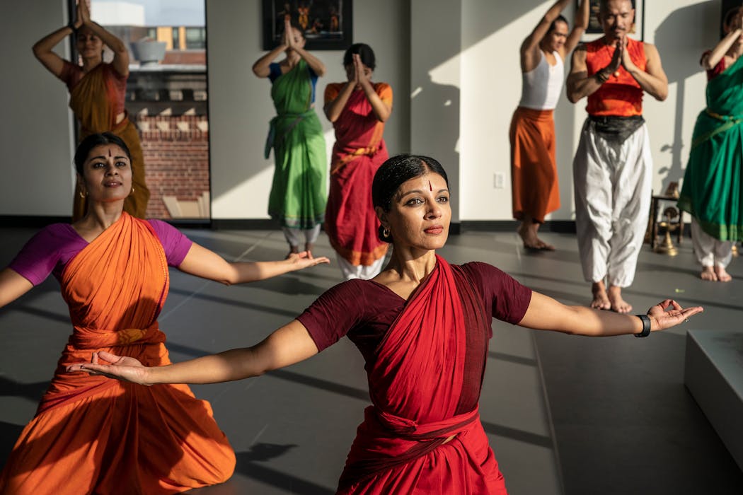 Ashwini, left, and Aparna Ramaswamy rehearsed earlier this month with other Ragamala Dance Company performers at the Center for Performing Arts in Minneapolis for their upcoming show, “Fires of Varanasi: Dance of the Eternal Pilgrim.”