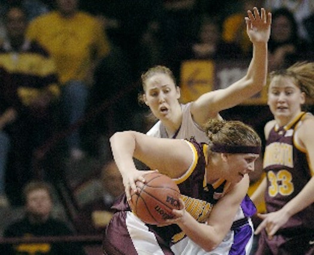 Nicole Ohlde and Kansas State were no match for the physical play of Gophers center Janel McCarville in an 80-61 victory in the second round of the 2004 NCAA women’s basketball tournament. The Gophers went on to reach the Final Four.