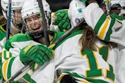 Hannah Halverson (10) of Edina celebrates with teammates after scoring a goal in the first period Thursday, February 24, at Xcel Energy Center in St. 