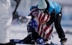 Jessie Diggins was comforted after crossing the finish during the women’s 30km mass start free cross-country skiing competition at the 2022 Winter O