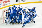 Minnetonka players kept their jubilation tight after they defeated Edina 2-1 in the Class 2A semifinals.