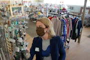 Sarah Colvin, a personal shopper at Arc Value Village in Richfield, searched for accessories for a client last week. 