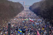 In Berlin, Germany, thousands of people walk down the bulevard ‘Strasse des 17. Juni’ for a rally against Russia’s invasion of Ukraine on Sunday