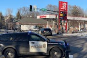 A woman is in custody after people were held hostage at an East Side St. Paul gas station on Tuesday. 