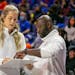 Florida head coach Kelly Rae Finley, left, and assistant Julian Assibey, right, talk over strategy before a game against South Carolina.