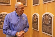 Oliva8: Tony Oliva pauses at the plaque of Twins teammate Harmon Killebrew during his March 2, 2022, visit to the Hall of Fame. (Milo Stewart Jr./Nati