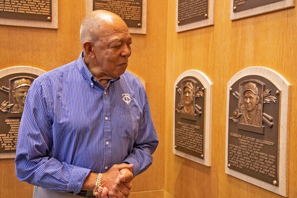 Oliva8: Tony Oliva pauses at the plaque of Twins teammate Harmon Killebrew during his March 2, 2022, visit to the Hall of Fame. (Milo Stewart Jr./Nati