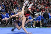 Chase Mills of St. Michael-Albertville took down Stillwater’s Mikey Jelinek in a 106-pound bout during the Class 3A team finals.