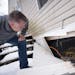 The Rev. Dean Swenson checked under a home in the Viking Terrace Mobile Home Park that he and several other community members helped winterize in Marc