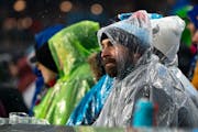 Minnesota United fans watch the first half of the season opener against Nashville during a heavy rain Saturday, March 5, 2022, at Allianz Field in St.