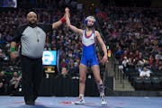 When Simley’s Charli Raymond was declared winner of the 100-pound class, she became the first girls’ wrestling state champion.