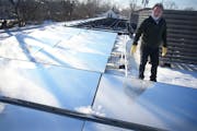 3M senior staff scientist Tim Hebrink showed the radiative cooling film that is installed on the roof of North Market in Minneapolis.
