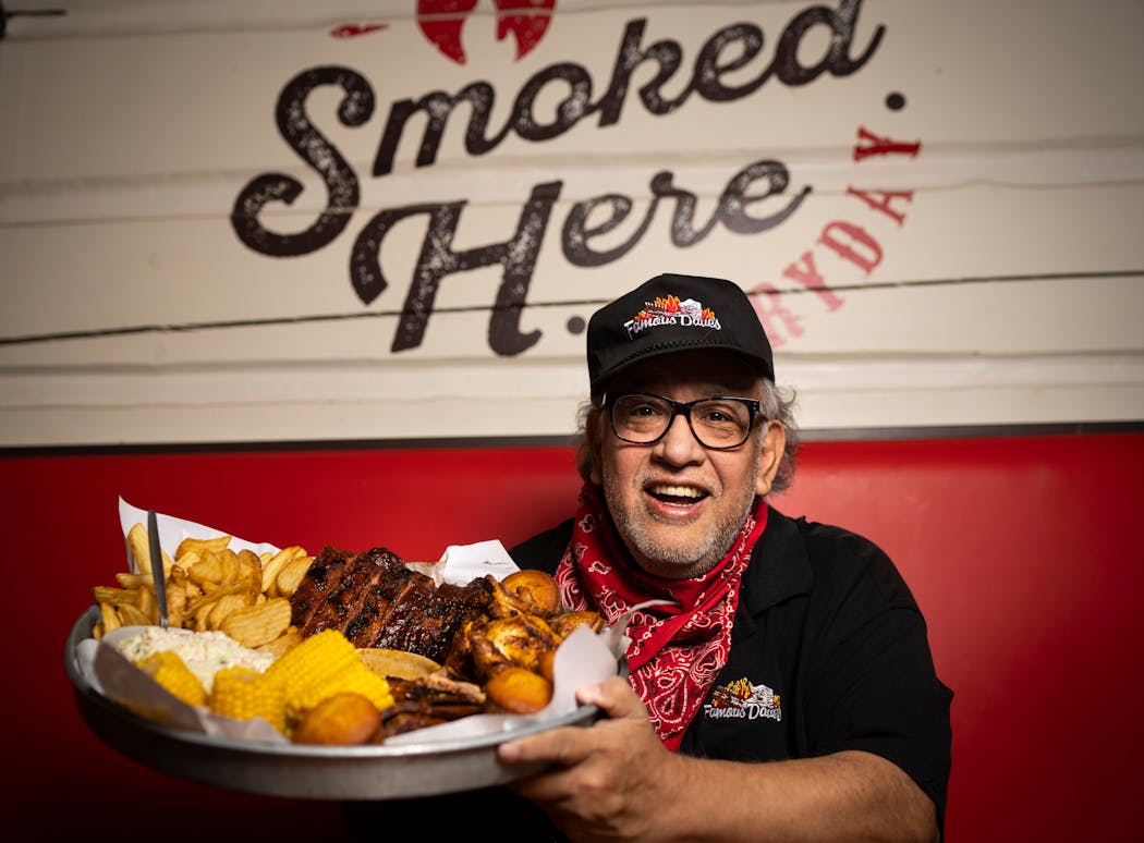 Famous Dave’s founder Dave Anderson posed for a photo with the All-American Feast at Famous Dave’s in Minnetonka.