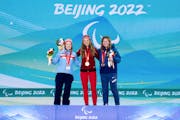 Gold medalist Natalie Wilkie, of Canada, center, poses with silver medalist Vilde Nilsen, of Norway, left, and bronze medalist Sydney Peterson, of Lak