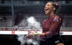 Mya Hooten, above at a meet last season, tied for first in bars and floor exercise on Friday as the Gophers tied Iowa in a dual meet.