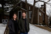 Jennifer Gunderson and husband Mike Swanson put off buying a new car and replacing windows at their St. Paul house.