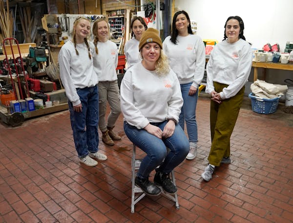 Rowland Paint owner and CEO Jessica Rowland, front center, with employees Hannah McNew, Haley Ryan, Katie Woodling, Mande Keir and Rachel Corradi.