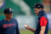 Newly acquired Twins pitcher Sonny Gray spoke with pitching coach Wes Johnson, left, during a spring training workout.