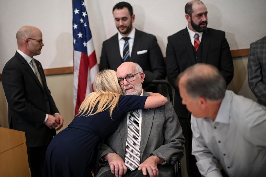 Sen. Karin Housley embraced Sen. David Tomassoni after a news conference on ALS legislation on March 1, 2022.