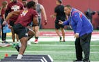 Defensive lineman Boye Mafe gets encourage from New York Giants assistant coach Andre Patterson, who used to be with the Vikings, during the Gophers�